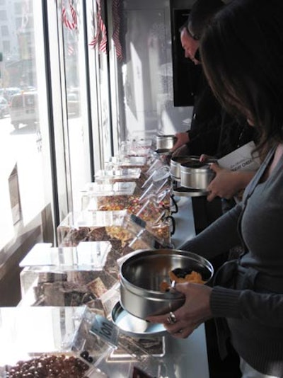 Guests filled tins with a variety of sweets from the candy buffet.