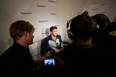 Behind the press risers, producers set up a step-and-repeat where reporters could conduct one-on-one interviews with each athlete immediately following the unveiling of the Fastskin 3 suits. As one would expect, 16-time Olympic medalist Michael Phelps (pictured), attracted a swarm of television crews.