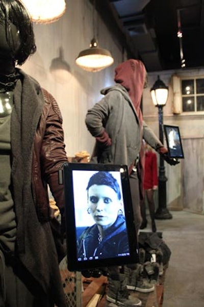 Ipads, attached to mannequins, showed images from the movie, The Girl With the Dragon Tattoo, at the H&M pop-up shop.