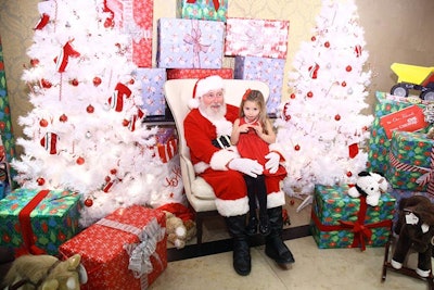In the children's workshop, sponsored by CVS, kids could get their photo taken with Santa, in addition to watching movies and working at arts and crafts stations.
