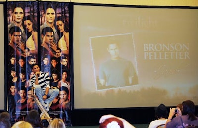 Bronson Pelletier, who plays Jared in the Twilight movies, was the first actor to take the stage at the Official Twilight Convention. Pelletier and the other cast members at the event signed four large banners used as the backdrop. At the end of the convention, organizers sold the banners to attendees in an auction.