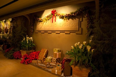 Holiday decor, including presents and boughs of pine with red ribbons, decorates the interior of the Regenstein Center.