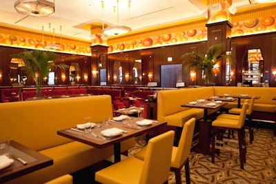 The main dining room has pendant lamps, leather seating, and a circumference adorned with a 200-foot lineal oil painting transferred onto canvas paper.