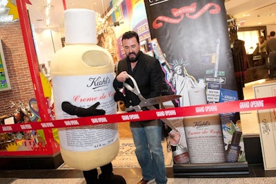 Company president Chris Salgardo cut the ribbon with the Kiehl's Creme de Corps mascot—who also marched in Chicago's Thanksgiving parade to promote the store a few weeks earlier.