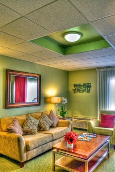 The suite's living area has luxurious furnishings and HDTVs.