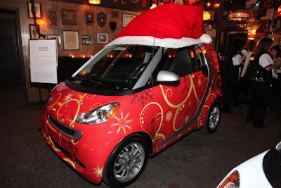 Guests got the chance to explore the holiday-wrapped Smart cars at the bowling holiday event.