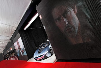 Sponsor BMW placed its i8 concept car between two large screens showing sponsor content and scenes from the film.