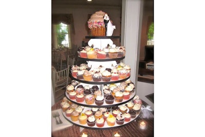 Wedding “dessert display” cupcake tower with big-top cupcake on cop