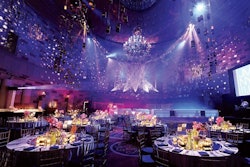 Jes Gordon/Proper Fun created a supper club atmosphere at Gotham Hall in New York for a recent bar mitzvah. Four-hundred luminaries filled with LED candles were hung from a large oval truss on the ceiling.
