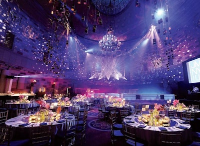 Jes Gordon/Proper Fun created a supper club atmosphere at Gotham Hall in New York for a recent bar mitzvah. Four-hundred luminaries filled with LED candles were hung from a large oval truss on the ceiling.