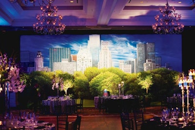 For a New York couple marrying at the Waldorf Astoria Orlando, Heather Snively of Weddings Unique recreated the newlyweds’ hometown with a hand-painted backdrop of Central Park from Greenery Productions. Lighting and real trees helped the scene come to life.