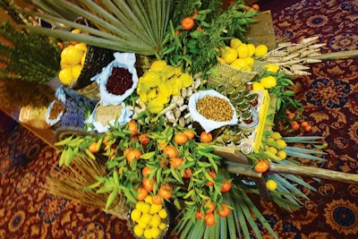 David Beahm Design put together a farm cart filled with Israeli market-inspired treats, like jars of honey, nuts, and dried apricots, which was displayed at the wedding of a couple looking to tie in their Israeli roots. Guests filled small burlap bags to take home.