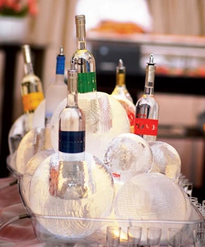 For a vodka shot bar at a birthday party designed by Kristi Amoroso Special Events, the bottles were displayed in a sculptural arrangement of textured ice spheres.