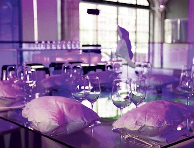 For a bat mitzvah at Guastavino’s in New York, Susan Holland Events used Tyvek pillows hand-stitched with neon thread as chargers. After the meal, waiters threw the pillows in the center of the tables, where they glowed under black light.