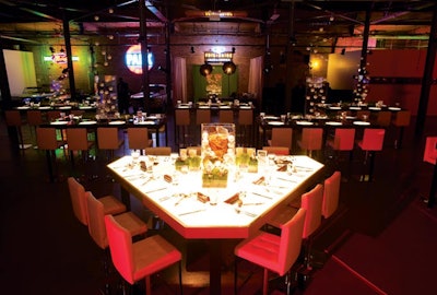 Jeffrey Foster of Event Creative designed custom-built tables and props, including glowing baseball diamond-shaped tables and a scoreboard that hung above the dance floor, for a bar mitzvah at the Ravenswood Event Center in Chicago.