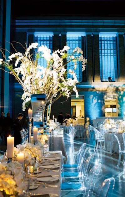For a wedding at the Museum of Fine Arts Boston, Marc Hall Design built seven-foot-tall mirrored glass vessels to hold apple tree branches adorned with phalaenopsis orchids that were kept hydrated through a system of hand-blown glass pipes.