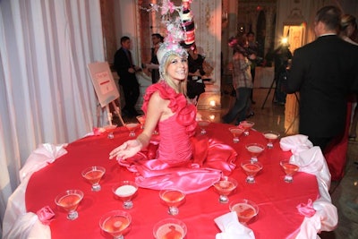 Staffers dressed in pink and walked around as mobile tables where they served pink cosmopolitans.
