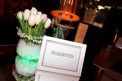 Arrangements of white tulips crowned the tables in the reserved lounge areas.
