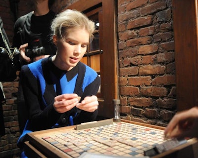 The mezzanine of the restaurant was converted into a games room for the soirée and included a table where models clad in the pre-fall collection played Scrabble.