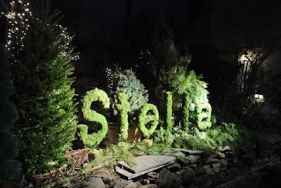 Adding further dimension to the event, a custom topiary spelling out the designer's name rested in the restaurant's outdoor garden, which was visible to guests through the windows.