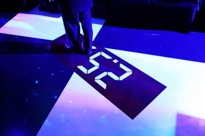 As a reminder of Chanel's numerical legacies, the producers digitally embedded numbers in the floor of the dinner space.