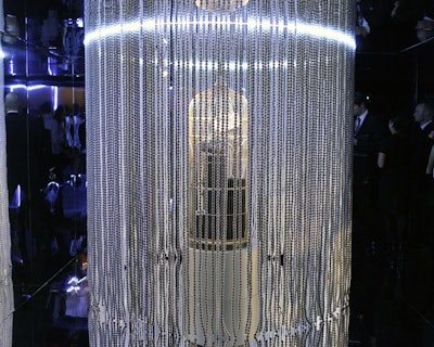 As a reference to the pearls adored by Coco Chanel, the producers hung curtains of white beads at various points throughout the exhibit, including around the accessories vitrine.
