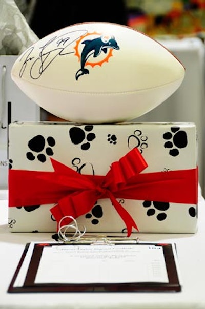 Silent auction items included a Miami Dolphins football autographed by Jason Taylor.