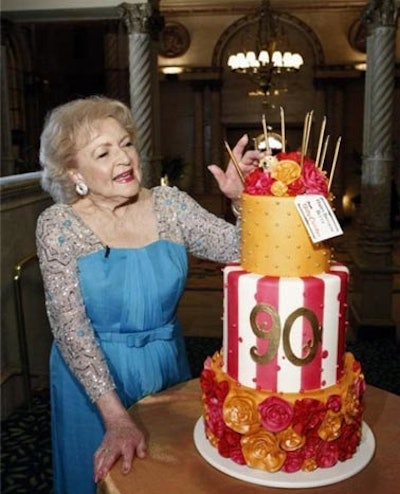 A giant, multitiered birthday cake from Betty Crocker was presented to White before the show.