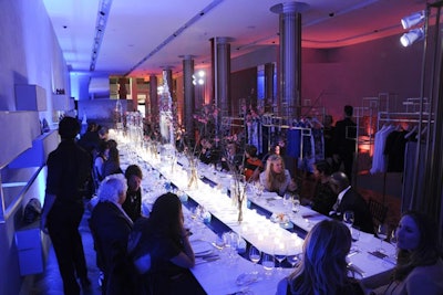 The dinner table was anchored by a vintage black-and-white scenic backdrop of the New York harbor, complete with the Statue of Liberty that the floating boats emerged from.