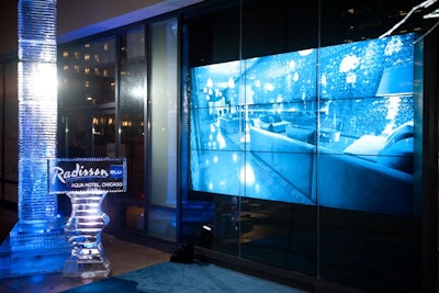 Behind the eight-foot ice sculpture, a video wall showed images of the hotel's interior.