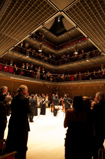 The new Calderwood Hall, where artists such as Yo-Yo Ma played throughout the weekend, has three balcony levels of single and front-row seating organized around a central performance area. There is no stage, only a flat floor, brightly inlaid with Alaskan yellow cedar and white oak.