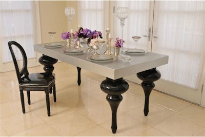 Dream legs on custom-finished table give a special look.