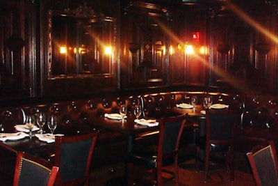 With tufted leather booths and wood-paneled walls, the space hosts cocktail receptions for 155.