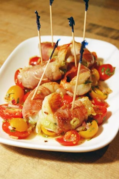 Servers circulated with prosciutto-wrapped shrimp stuffed with avocado and served on a bed of salsa.