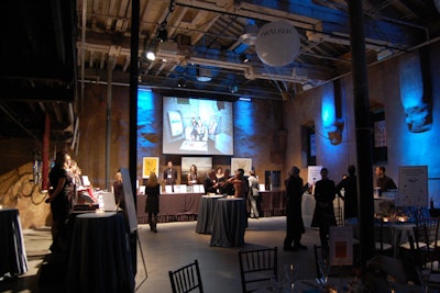 Volunteers greeted guests at the silent auction area. Flipbook photos taken at last year's gala were projected in sequence overhead.