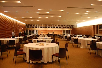 Round tables sat in view of a stage in the Bram and Bluma Appel Salon.