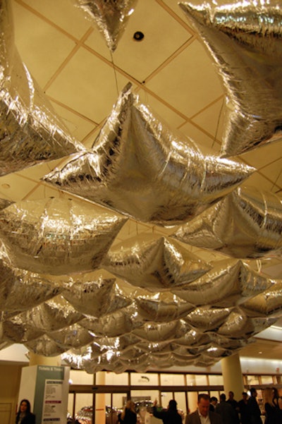 The 'Silver Cloud' installation hung above the Ikea ticket counter at the entrance. As guests walked below, the silver pillows inflated and deflated.