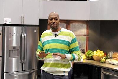 Former NBA star John Salley made an appearance and signed autographs at Haier's booth to help launch the appliance company's new kitchen products.