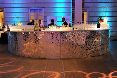 Guests lined up at massive mirrored mosaic bars in the Kogod Courtyard.