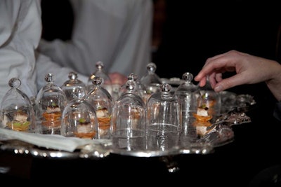 Canapes served on large silver platters included petite croque monsieurs and madames, pheasant under glass bites (pictured), and Beau Soleil oysters in their shells and topped with vinegar and shallot pearls.