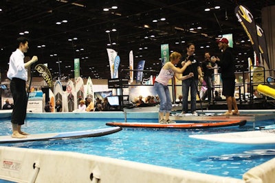 Throughout the three-day show, attendees could try stand-up paddle boarding at a 25- by 45-foot pool constructed on the expo floor.