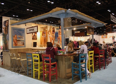 Heat Swimwear's booth included a three-sided bar with a small runway in the middle.
