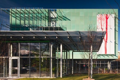 The new wing sits behind the original building and incorporates sustainable design elements such as a geothermal well system, daylight harvesting, water-efficient landscaping techniques, and local and regional building materials.