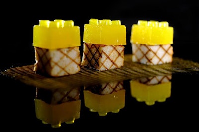 Lemon 'lego' cubes top pieces of grilled chicken.