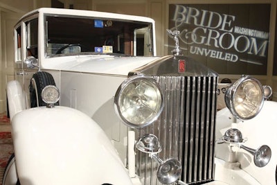 Guests walked by a white Rolls Royce before entering the event.