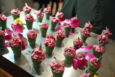 Waiters carried trays of beet salad hors d'oeuvres.