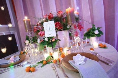In the Grand Ballroom, a table setting from A. Dominick Events included details like fruit and scented candles.