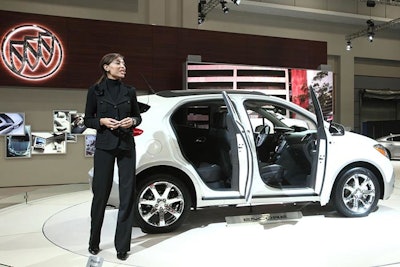 Speakers, like the one at the Buick booth (pictured), explained new automobile features and options to show visitors.