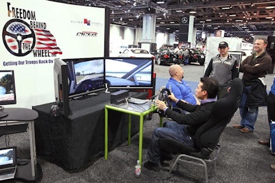 Freedom Behind the Wheel, a nonprofit organization that helps wounded veterans participate in motorsports, brought in a simulator demonstrating how hand-control driving works.