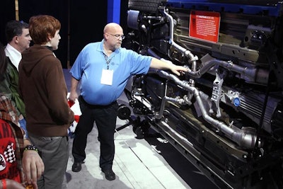 An upturned car allows attendees to learn about the latest Ford technology.